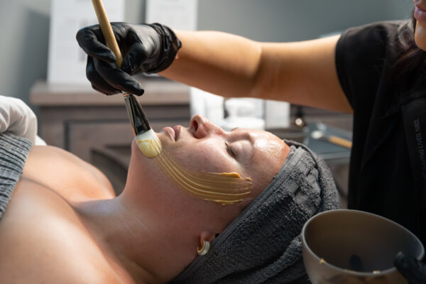 A woman receives one of SPRY's relaxing medical-grade facials near Cedar Falls