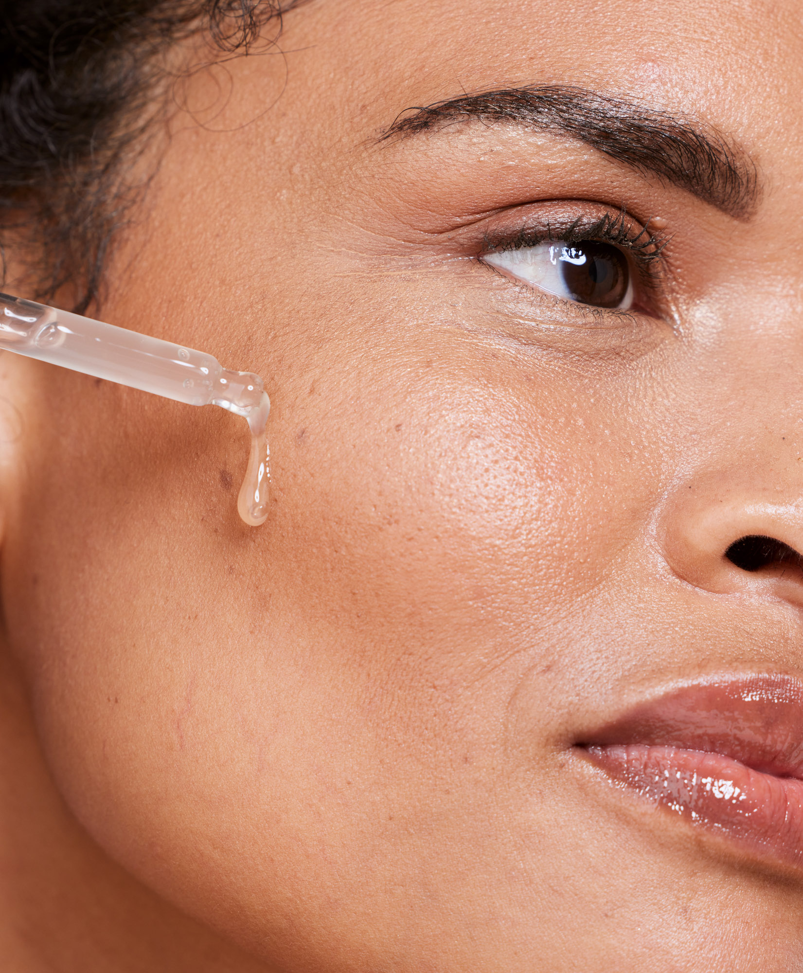Oil, skincare and woman for beauty, product and cleaning, wellness and hygiene closeup. Face, facial and serum by model and essential oils, retinol or anti aging skin moisturiser, liquid or mask.