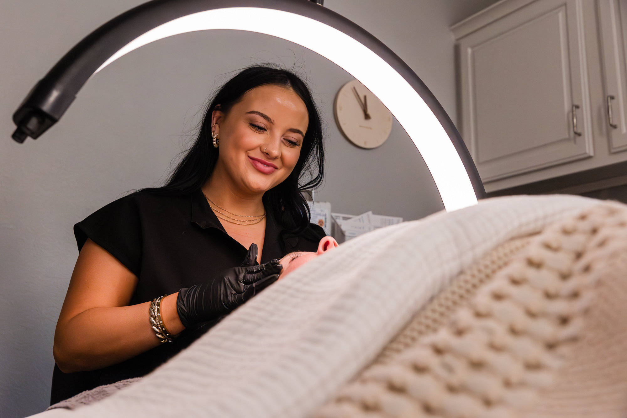 One of our team members conducts a facial for a client, soothing their skin for a comprehensive rosacea treatment in Waterloo.