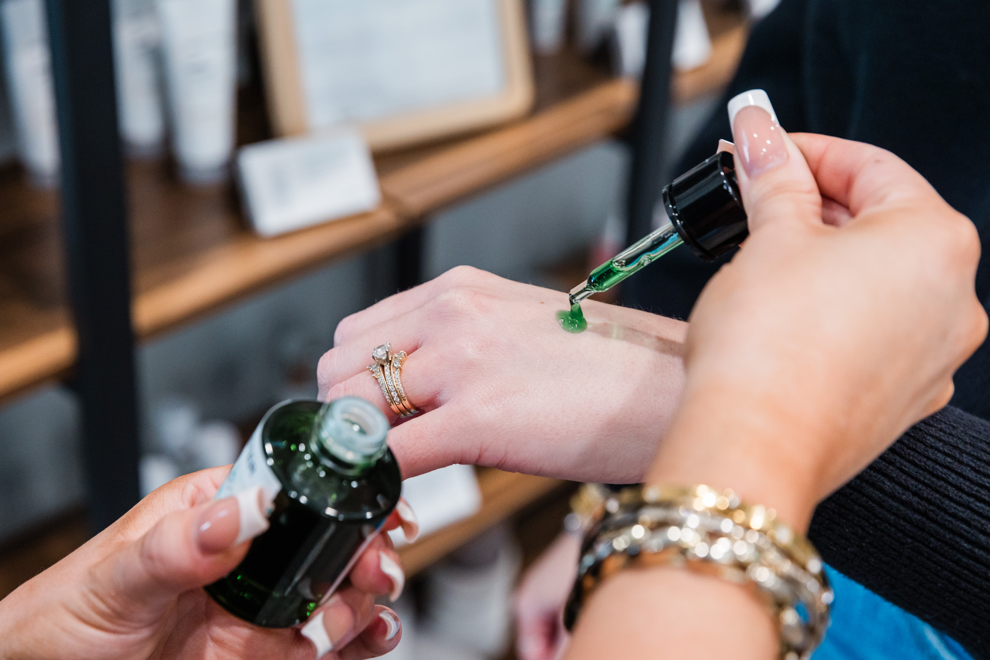 a woman's hand getting a dab of skincare ointment added to it as part of treatment for melasma in Waterloo