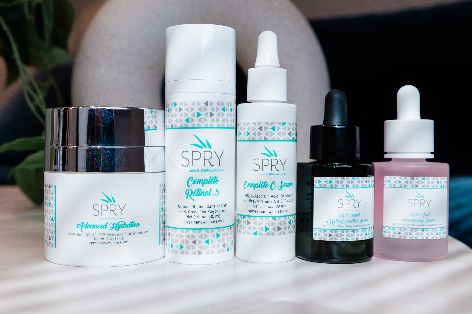 An image of various skincare products at SPRY Skin & Wellness that your provider may be likely to recommend after getting hyperpigmentation treatment in Waterloo.